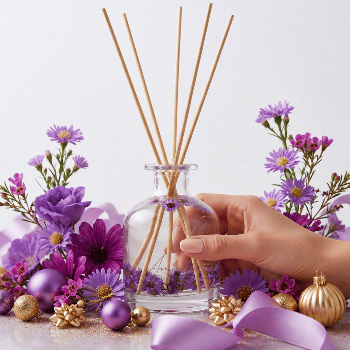 reed diffuser with flowers styled with pink and gold christmas decorations