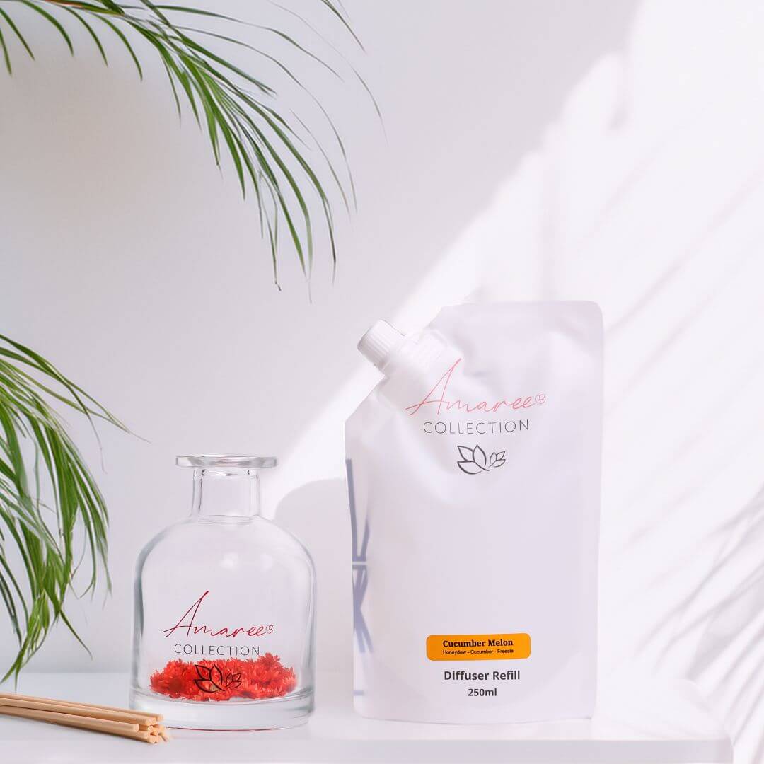 Cucumber Melon Reed Diffuser Refill 250ml with elegant glass container and natural decor accents.