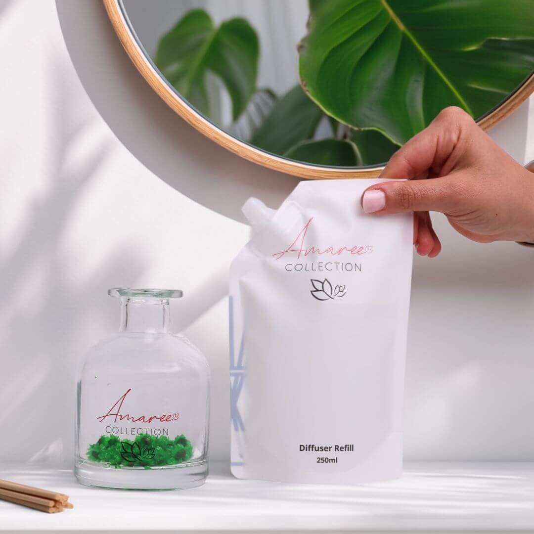 Lemongrass & Persian Lime Reed Diffuser Refill 250ml next to a stylish glass diffuser.