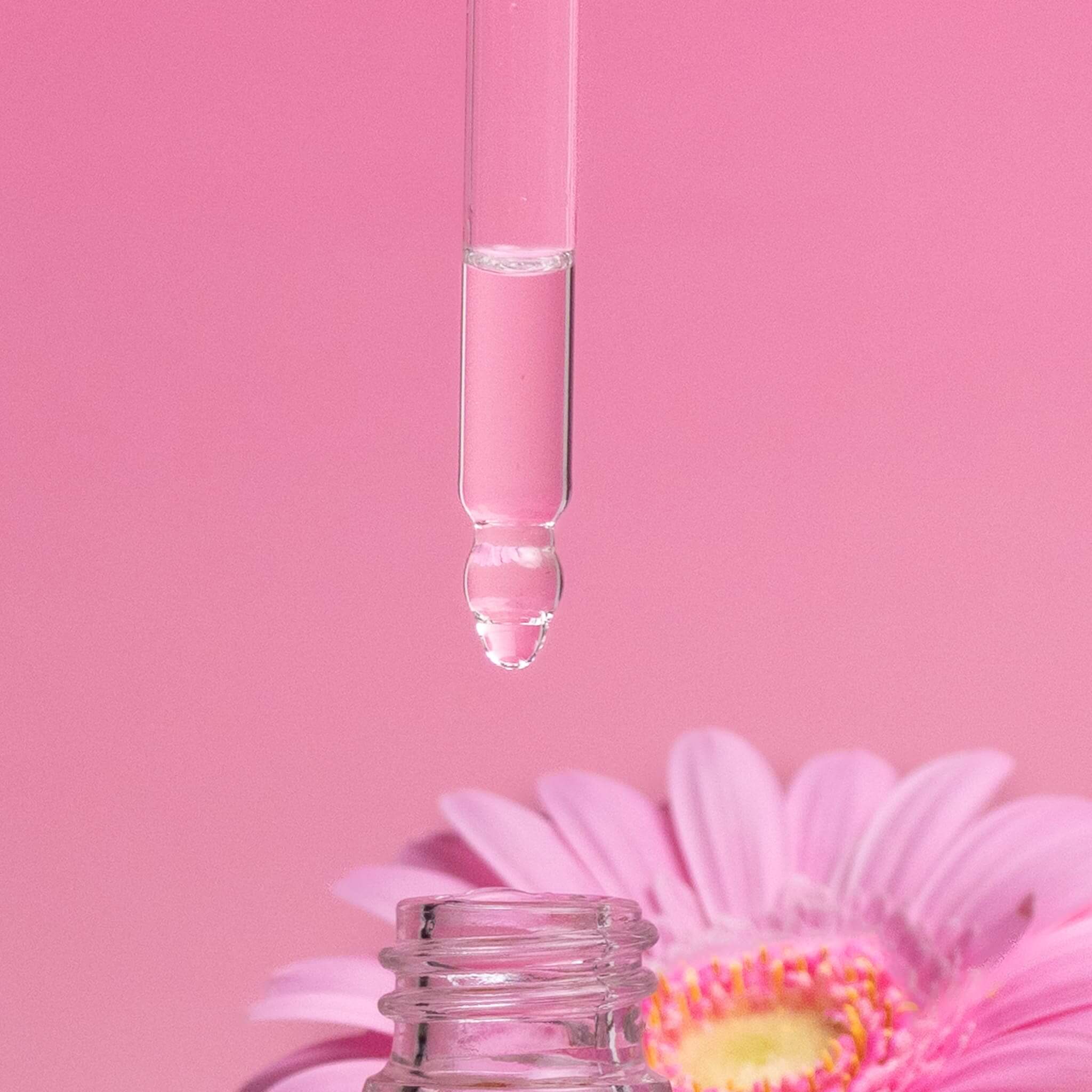 Lychee Peony Car Diffuser Refill dropper with soft floral fragrance oil against pink background