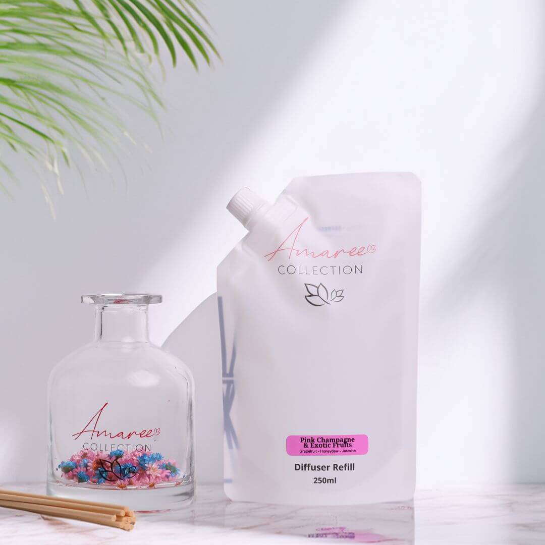 Pink Champagne & Exotic Fruits Reed Diffuser Refill 250ml in elegant packaging displayed with decorative diffuser.