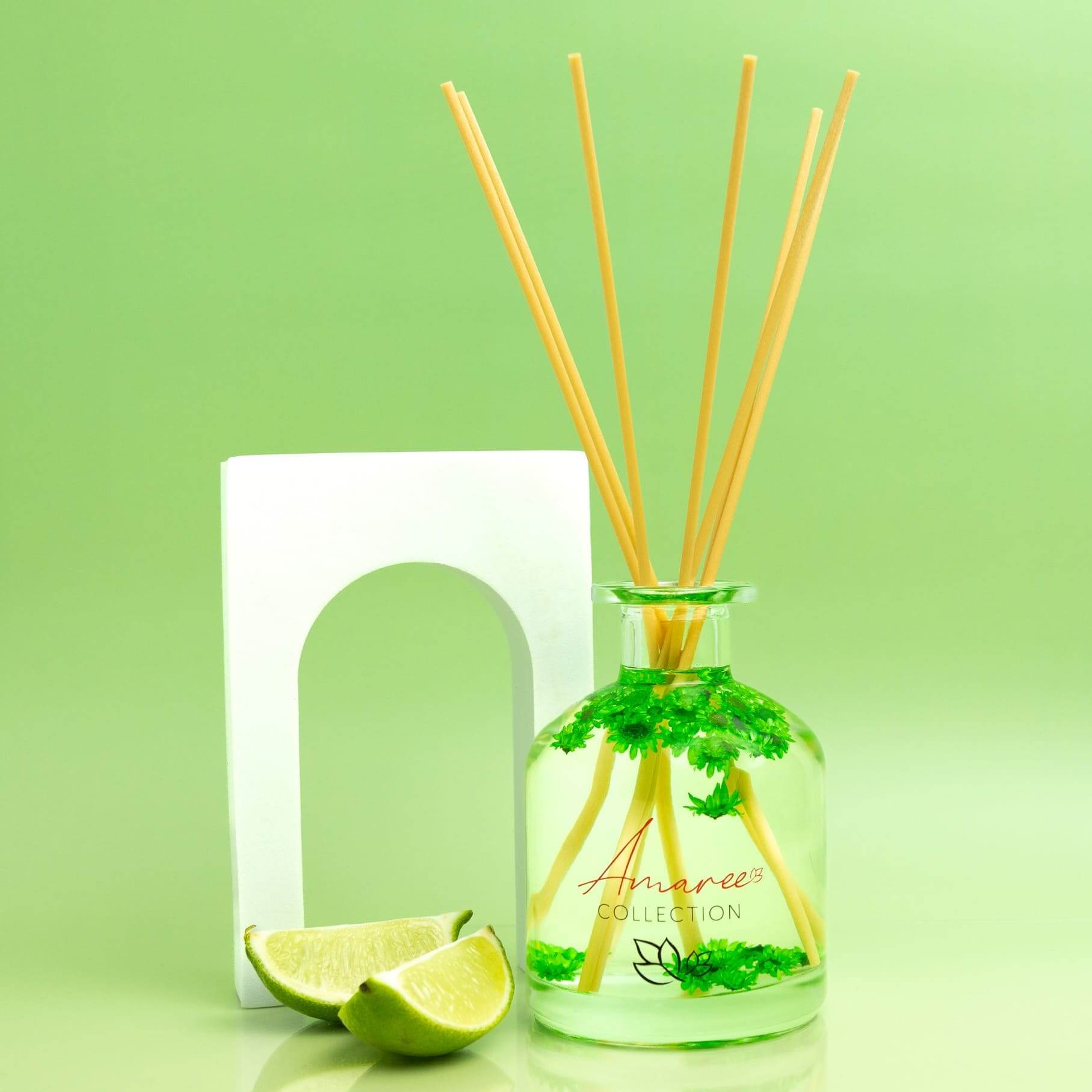 Coconut Lime Reed Diffuser 250ml in a glass bottle with lime slices and reed sticks, perfect for uplifting tropical ambiance.