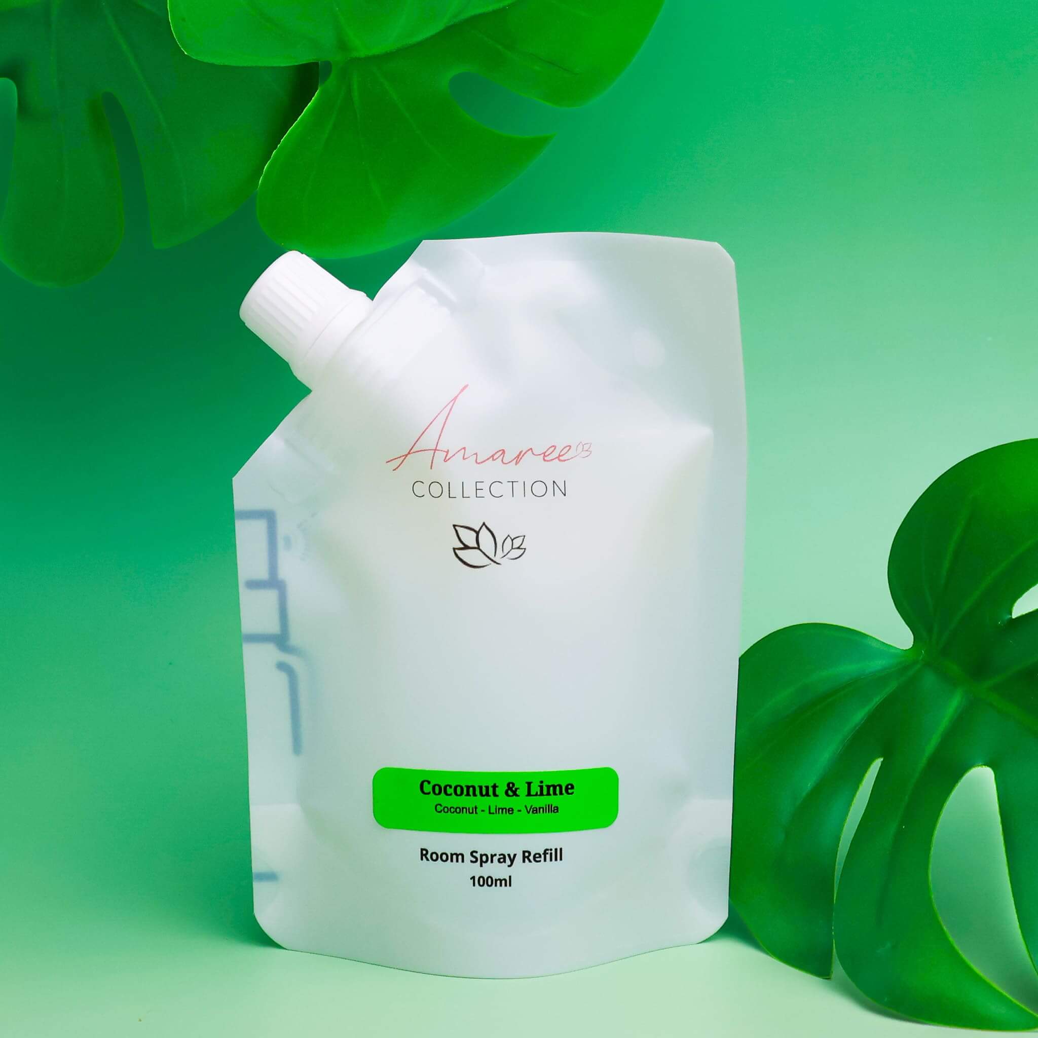 Coconut Lime Room Spray Refill 100ml pouch with tropical green background.