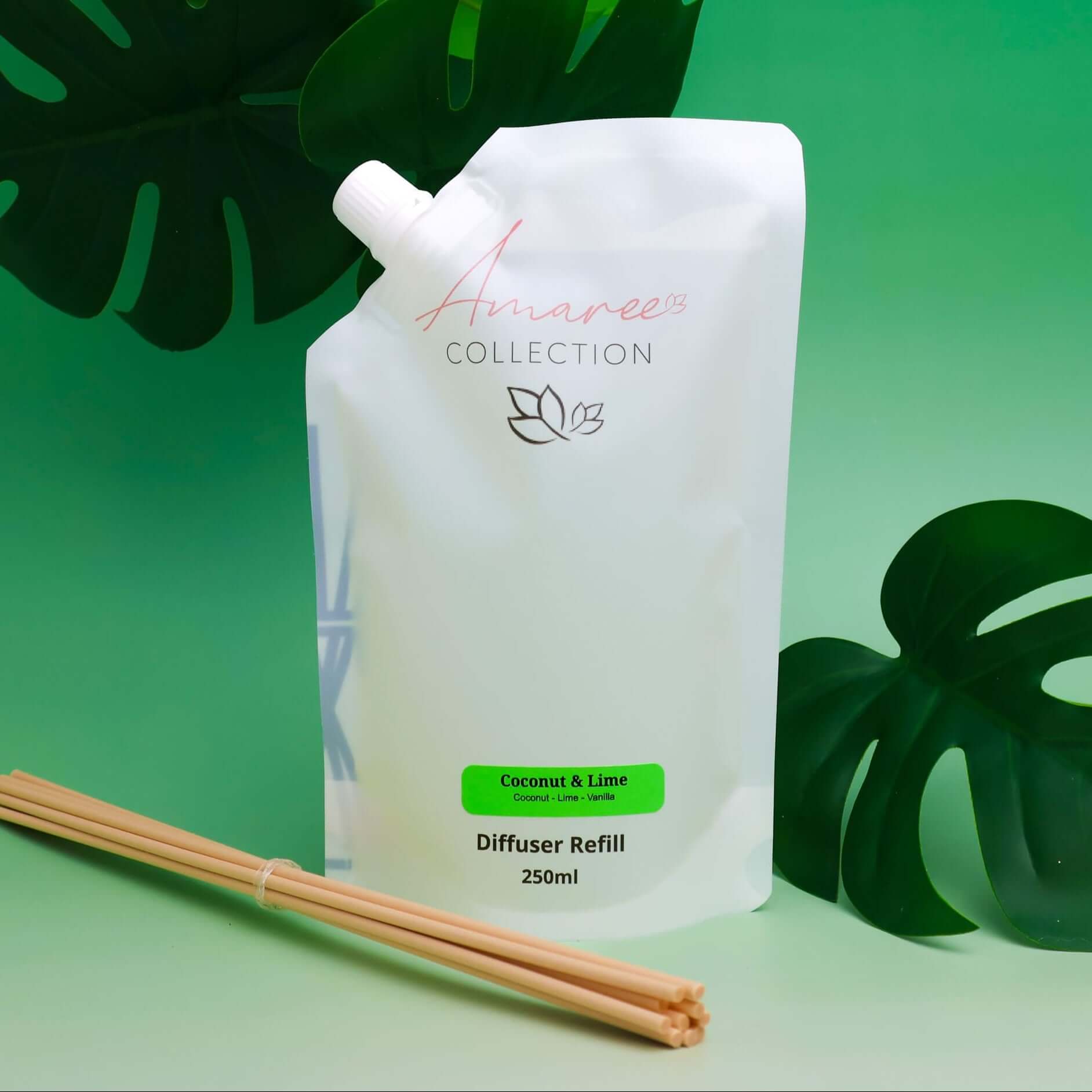 Coconut & Lime Reed Diffuser Refill 250ml in a pouch with reeds and tropical background.
