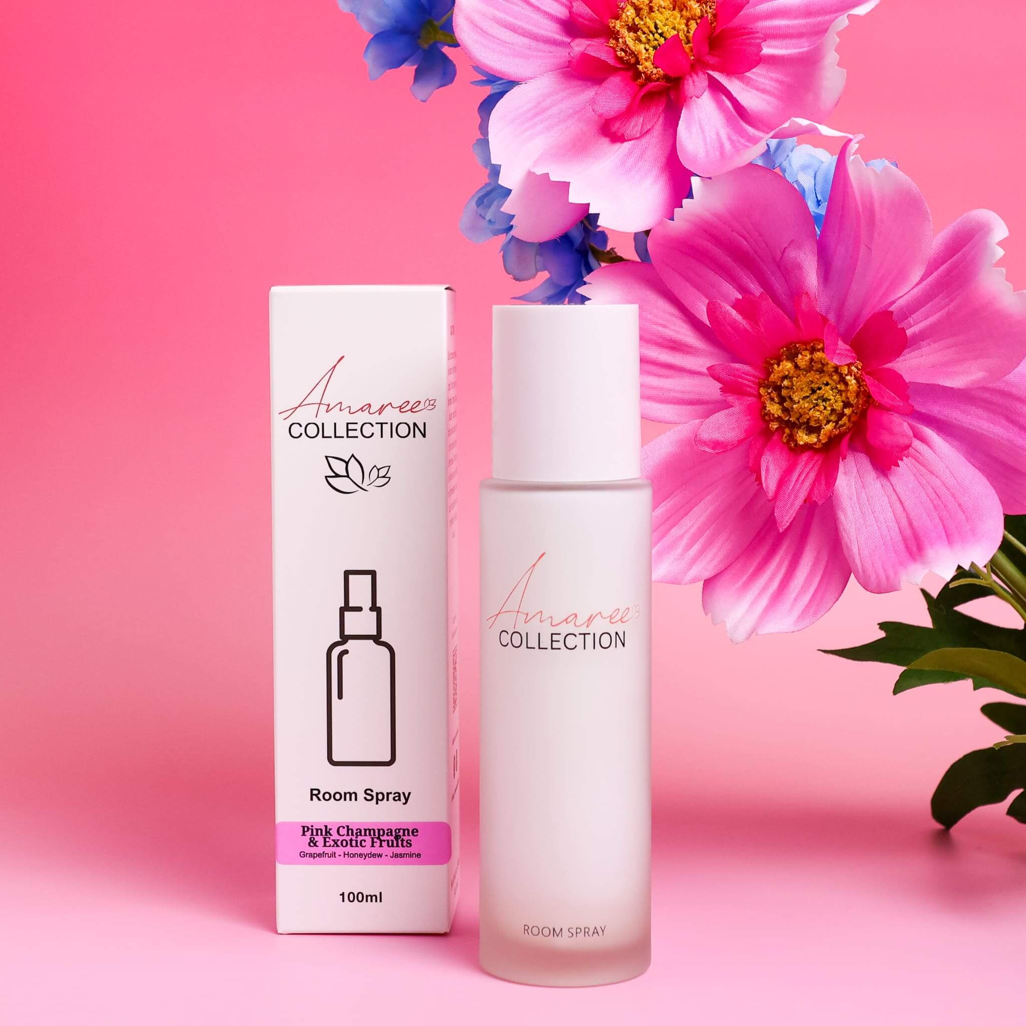 Pink Champagne & Exotic Fruits Room Spray 100ml in elegant packaging with flowers, vibrant scent for an uplifting atmosphere.
