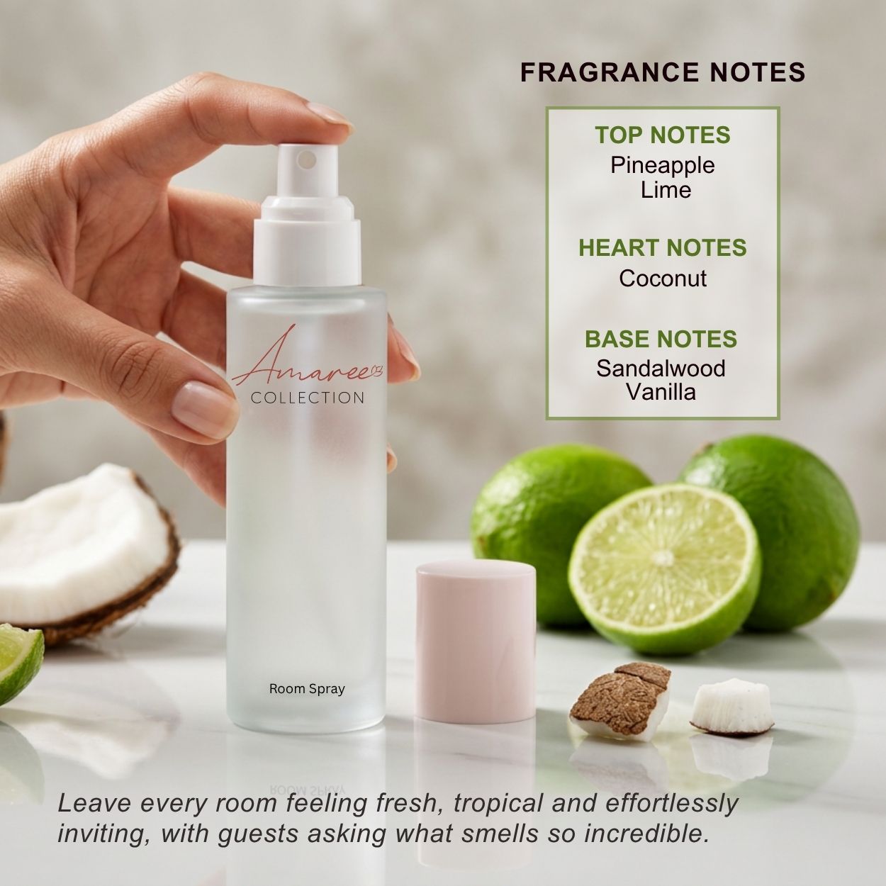 A hand holds a frosted room spray bottle labeled &
