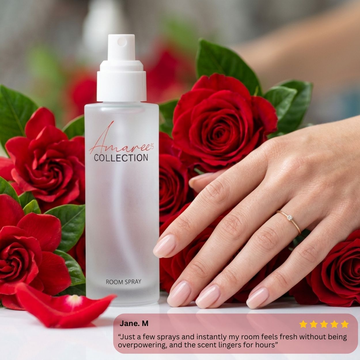 A frosted glass room spray bottle labeled &