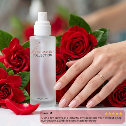 A frosted glass room spray bottle labeled &