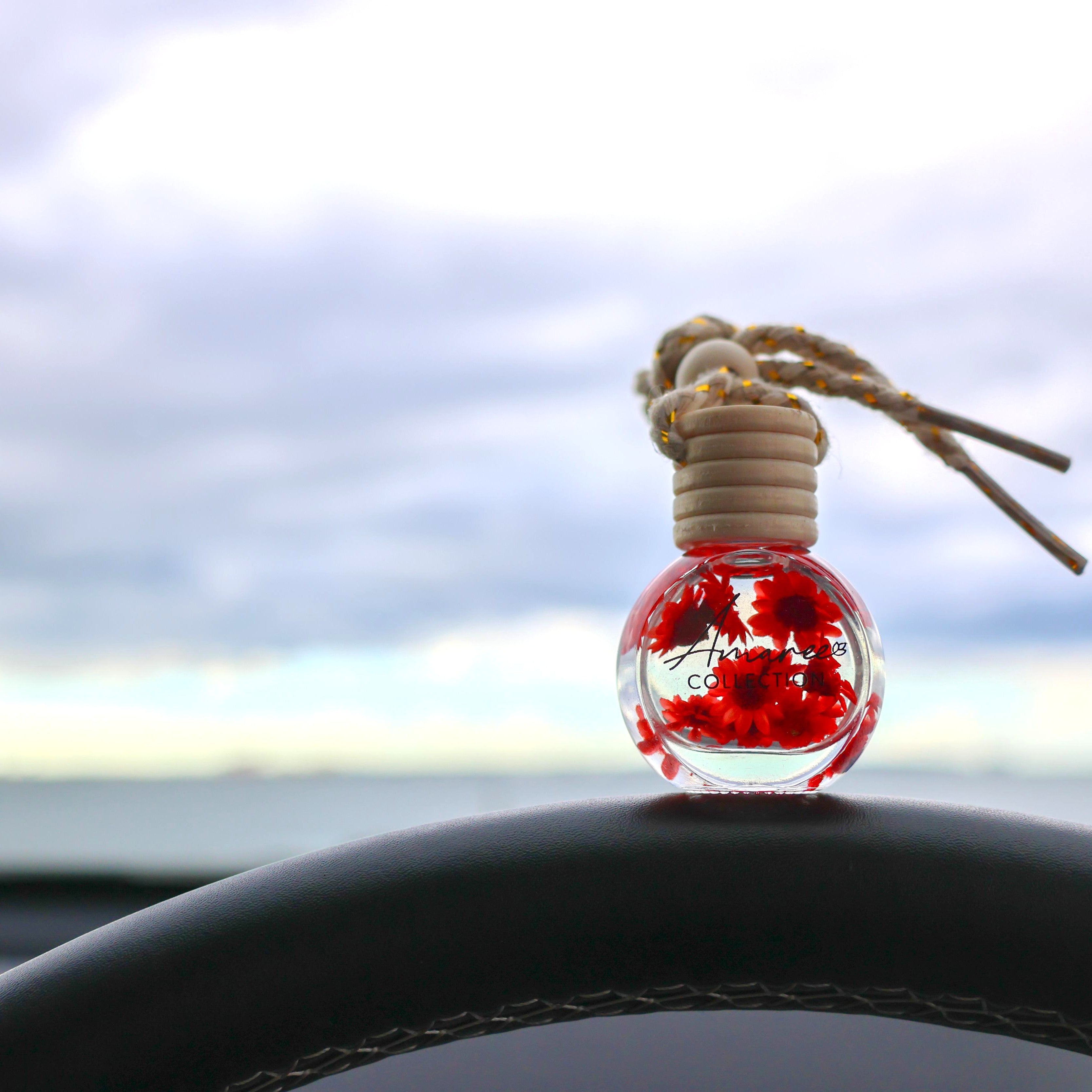 car diffuser with red flowers