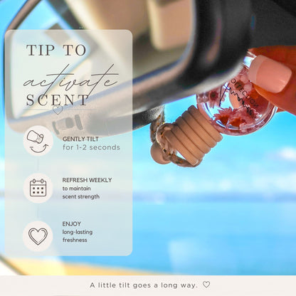 Car air freshener with instructions on how to activate the scent against a blurred blue background
