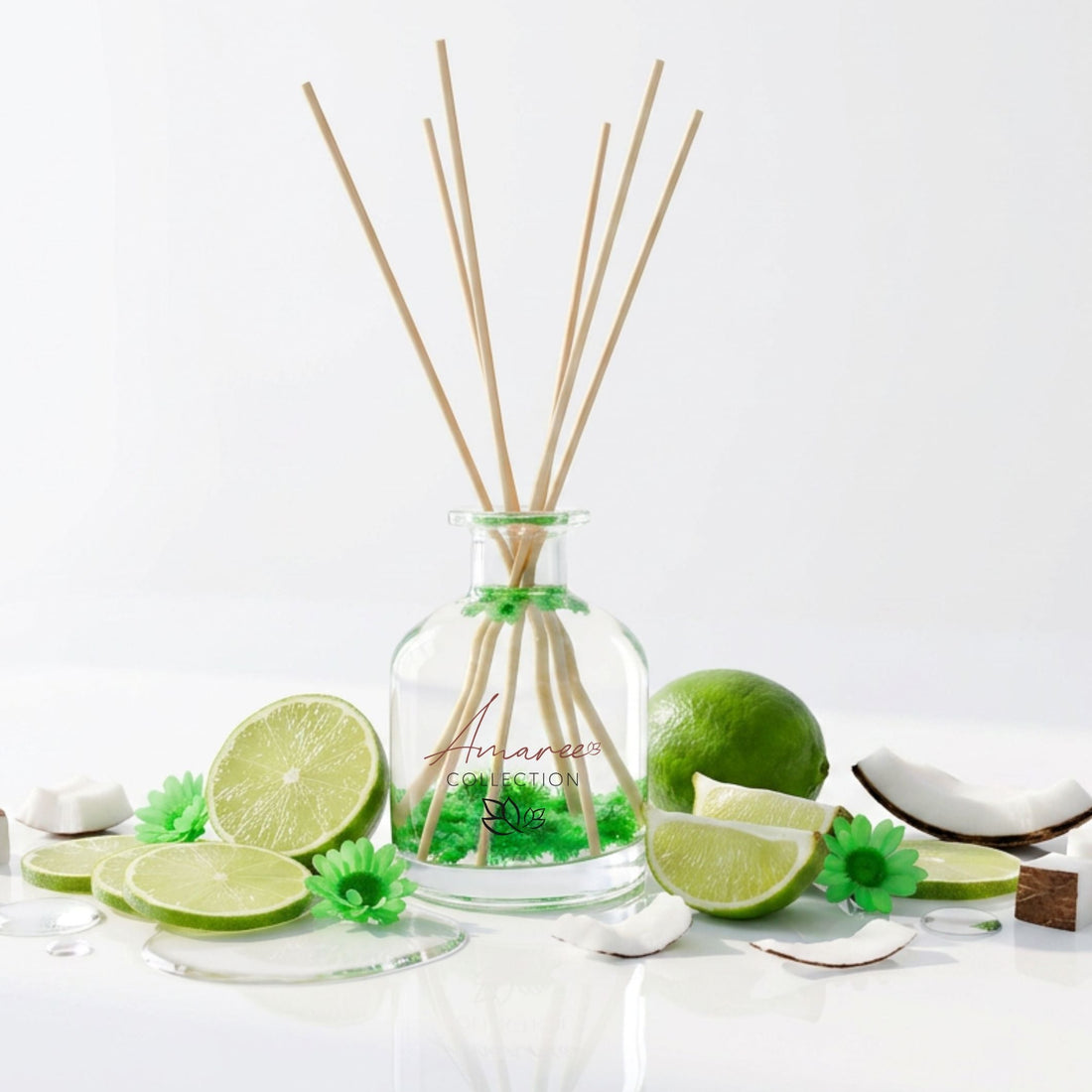Reed diffuser with lime and coconut elements on a white background