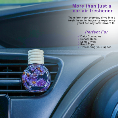 A round car air freshener bottle with dried flowers and purple petals, inserted into a car air vent. The image includes promotional text highlighting its benefits for daily commutes, school runs, and road trips.