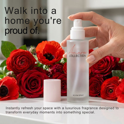 A hand holds a frosted glass room spray bottle labeled &