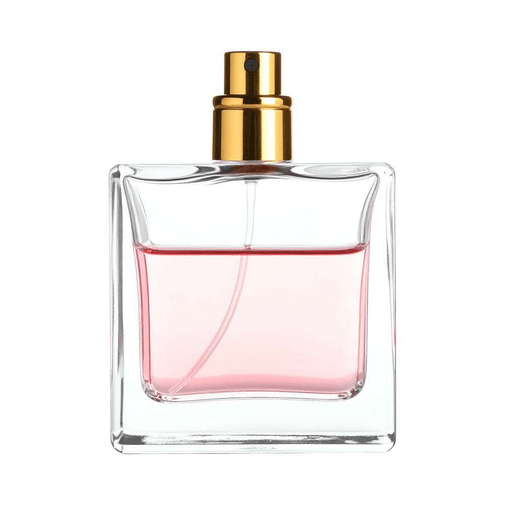 A square clear glass perfume bottle filled with light pink liquid, topped with a shiny gold spray nozzle, isolated on a white background.