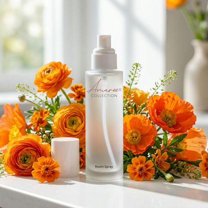 A frosted glass room spray bottle labeled &