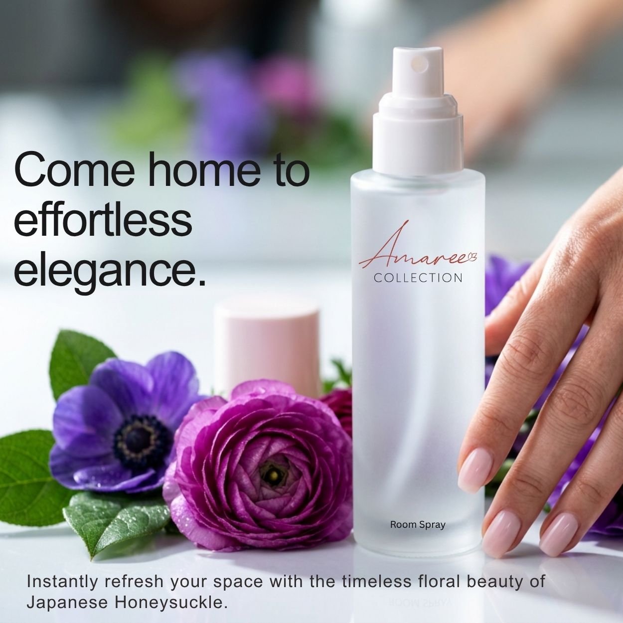 A frosted glass room spray bottle labeled &