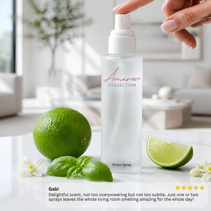 A frosted glass room spray bottle labeled &