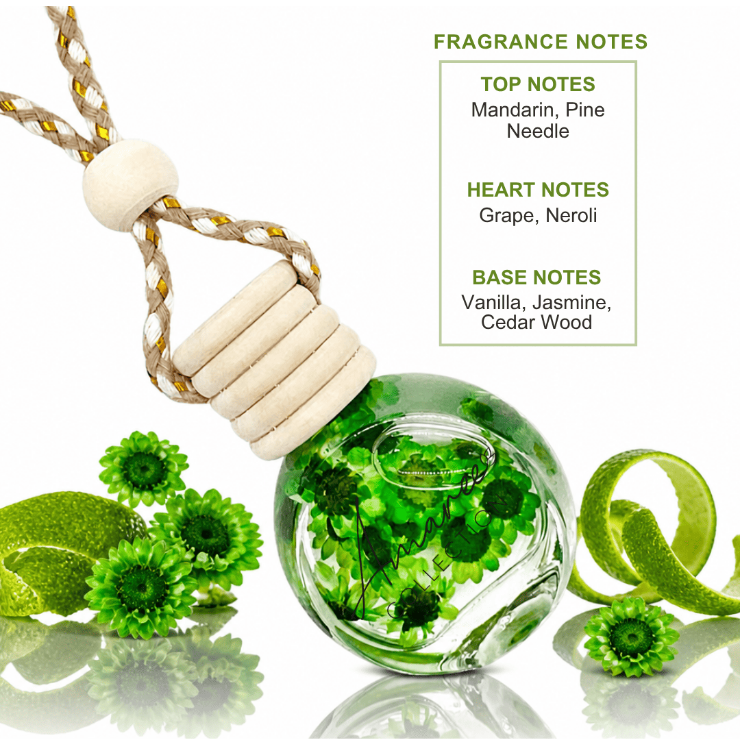 A glass fragrance diffuser or ornament with a beige rope loop and wooden bead cap, filled with green botanical elements. The product is shown on a white background with green citrus peels and flowers, alongside text listing fragrance notes: Mandarin, Pine, Needle, Grape, Neroli, Vanilla, Jasmine, and Cedar Wood.