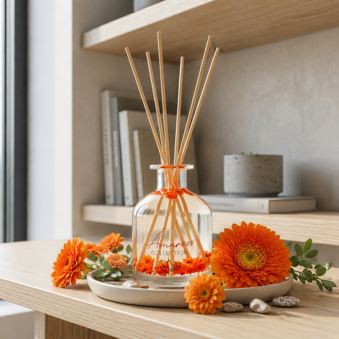 home fragrance diffuser with wooden sticks and orange flowers on a table.