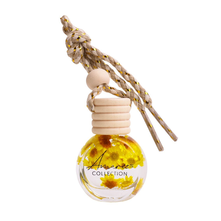 Car air freshener with floral design and braided rope on a white background