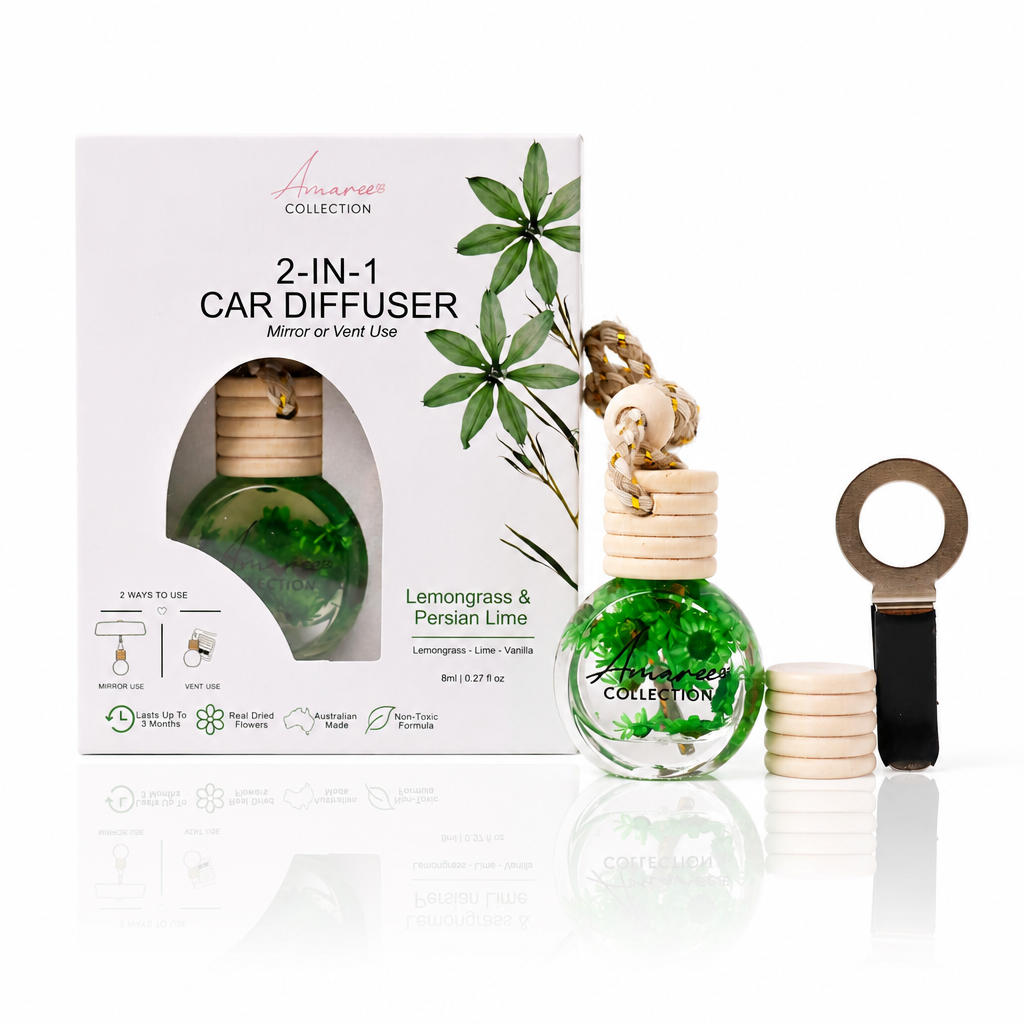 A 2-in-1 car diffuser set from the brand Avancer Collection, featuring a green liquid-filled bottle with a wooden diffuser top, a matching retail box, and a wooden reed stick on a clean white background with a soft reflection.