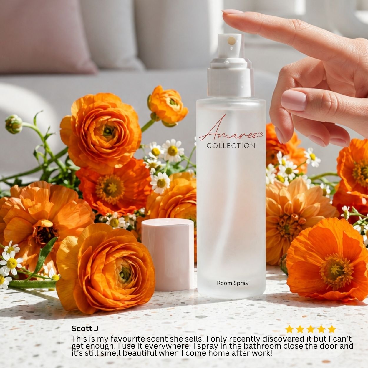 A frosted glass room spray bottle labeled &