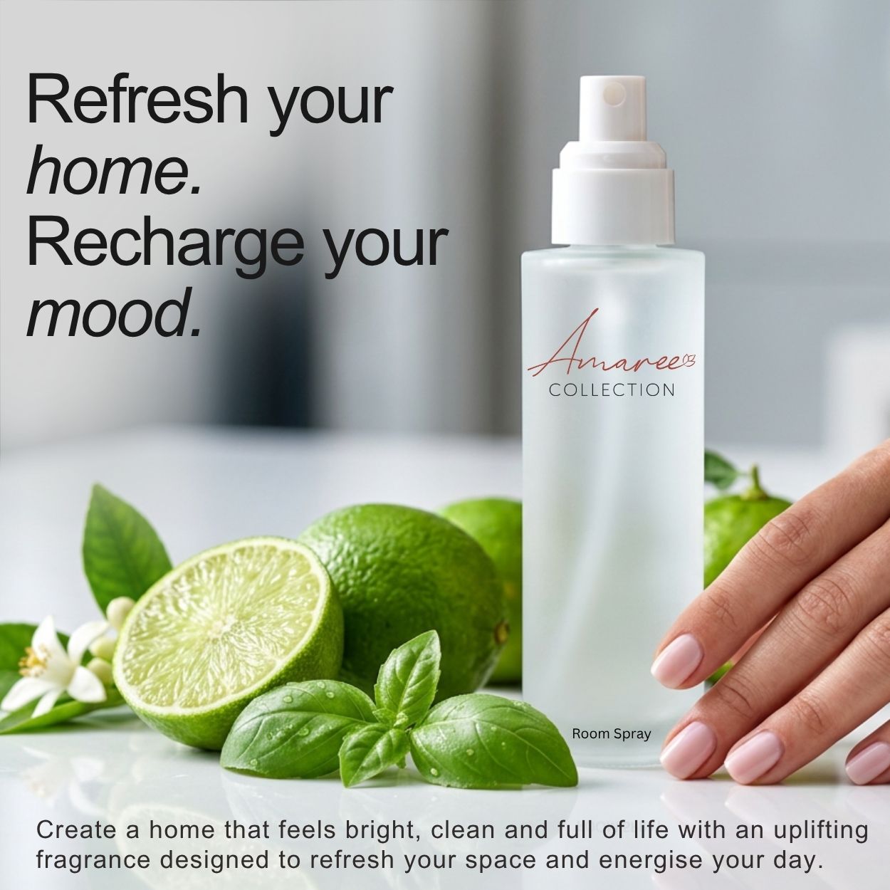 A bottle of Amaree Collection Room Spray stands on a countertop beside limes, basil leaves, and a hand with pale pink manicured nails. Large text reads &