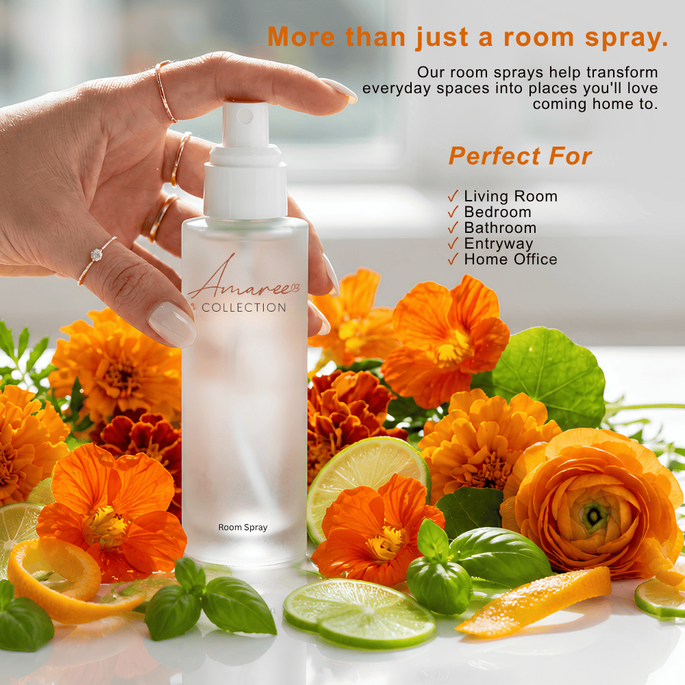 A hand holds a frosted room spray bottle labeled &