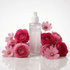 A frosted glass room spray bottle with a white pump, labeled &