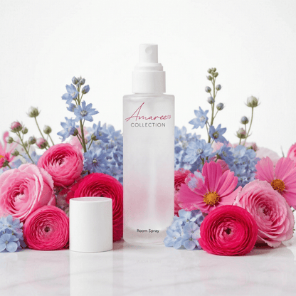 A frosted glass room spray bottle labeled &