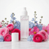A frosted glass room spray bottle labeled &