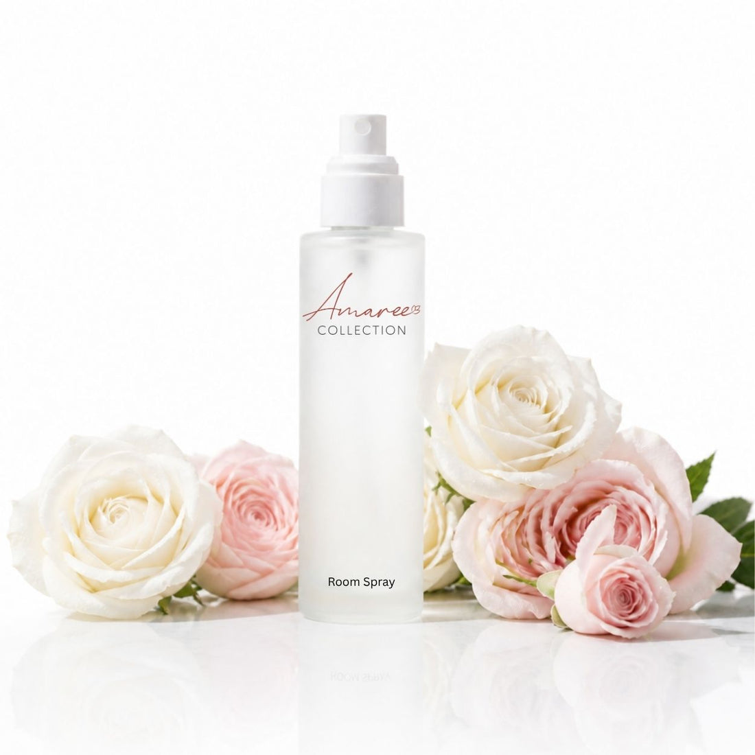 A frosted glass room spray bottle with a white pump dispenser, labeled &