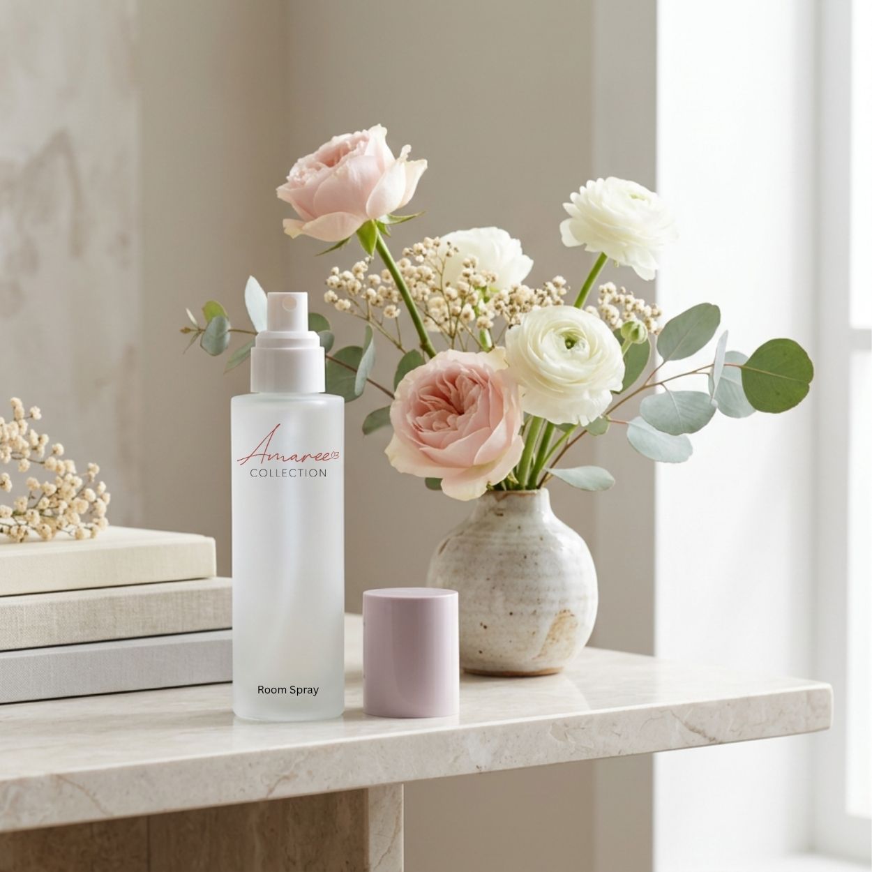 A white room spray bottle labeled &