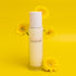Vanilla, Patchouli & Sandalwood Room Spray 100ml with bright yellow flowers on a yellow background.